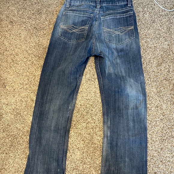 Blue denim Wrangler jeans with a distressed wash - Picture 3 of 4